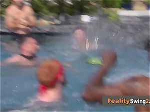 Couples have fun at the pool as they get prepped to party in the red apartment
