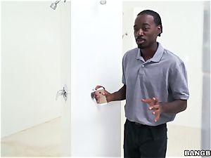 Curly dark-hued damsel takes a giant black fuck-stick in the men's locker room